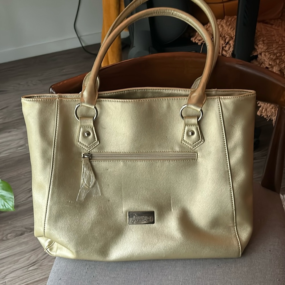 Initials inc, muted gold purse. Deep pockets. Hold your laptop, great for travel